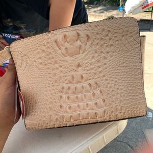 Peach colored snake skin crossbody bag